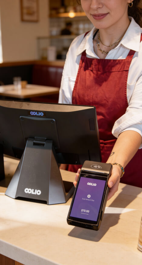 Oolio payment device held by waitress behind the counter